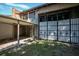 View of a property's garage with gated access and covered carport at 1240 Tangerine Ct, Eustis, FL 32726