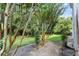 Landscaped backyard with mature trees and grassy area at 11508 Westwood Blvd # 328, Orlando, FL 32821