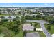 Aerial view of house and surrounding community, showcasing the neighborhood and landscape at 5500 Belle Terre Dr, Leesburg, FL 34748