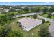 Aerial view of house, yard, and neighborhood at 5500 Belle Terre Dr, Leesburg, FL 34748
