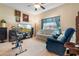 Home office with wood desk, built-in cabinets, and printer at 5500 Belle Terre Dr, Leesburg, FL 34748