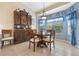 Breakfast nook with a round table and antique cabinet at 5500 Belle Terre Dr, Leesburg, FL 34748