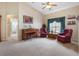 Sitting room with piano, two armchairs and a window at 5500 Belle Terre Dr, Leesburg, FL 34748
