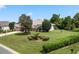 Single-story house with attached garage and nicely landscaped yard at 5500 Belle Terre Dr, Leesburg, FL 34748