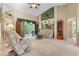 Living room with two armchairs, sofa and a ceiling fan at 5500 Belle Terre Dr, Leesburg, FL 34748