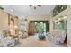 Relaxing living room with ample seating and large windows at 5500 Belle Terre Dr, Leesburg, FL 34748