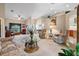 Bright living room featuring a large window and comfortable armchairs at 5500 Belle Terre Dr, Leesburg, FL 34748