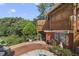 Quaint patio area with lush landscaping and a whimsical feel at 151 S Clayton St, Mount Dora, FL 32757