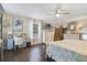 Spacious main bedroom with large bed, dresser, and hardwood floors at 151 S Clayton St, Mount Dora, FL 32757