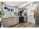 Modern kitchen with stainless steel appliances and wood cabinets at 151 S Clayton St, Mount Dora, FL 32757
