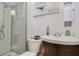 Clean bathroom with shower, toilet and pedestal sink at 151 S Clayton St, Mount Dora, FL 32757