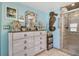 Coastal-themed bathroom with walk-in shower and unique decor at 151 S Clayton St, Mount Dora, FL 32757