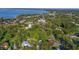 Aerial view showing a lakefront community with lush greenery at 151 S Clayton St, Mount Dora, FL 32757