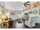 Bright living room with comfy seating, dark hardwood floors, and decorative wall art at 151 S Clayton St, Mount Dora, FL 32757