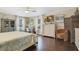 Spacious main bedroom with king bed, hardwood floors, and coastal decor at 151 S Clayton St, Mount Dora, FL 32757