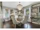 Bright dining area, featuring a glass-top table and hardwood floors at 151 S Clayton St, Mount Dora, FL 32757