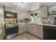 Modern kitchen with stainless steel appliances and wood cabinets at 151 S Clayton St, Mount Dora, FL 32757