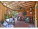 Relaxing back porch with wicker chairs and ceiling fan at 151 S Clayton St, Mount Dora, FL 32757