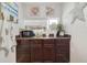Charming kitchenette with dark wood cabinets and granite countertop at 151 S Clayton St, Mount Dora, FL 32757