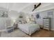 Cozy bedroom with a queen-size bed and ceiling fan at 151 S Clayton St, Mount Dora, FL 32757