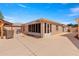 Backyard view showing patio, screened enclosure, and pergola at 880 Trevino Ter, The Villages, FL 32159