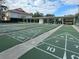 Shuffleboard courts with covered seating and numbers at 6410 Tildon Ct, Leesburg, FL 34748