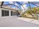 Large screened patio with backyard view at 2079 Clarks Hill Way, The Villages, FL 32162