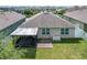 House with backyard, screened patio, and pavers at 3450 Landing Vw, Tavares, FL 32778