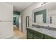 Main bathroom with single vanity and view of another room at 3450 Landing Vw, Tavares, FL 32778
