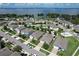Aerial view of houses and neighborhood by the lake at 3450 Landing Vw, Tavares, FL 32778
