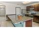 Modern kitchen with granite countertops and stainless steel appliances at 3450 Landing Vw, Tavares, FL 32778