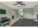 Main bedroom with a king bed and en-suite bathroom view at 3450 Landing Vw, Tavares, FL 32778