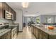 Modern kitchen with granite countertops and stainless steel appliances at 3450 Landing Vw, Tavares, FL 32778