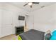 Bedroom with a green bed frame and built-in entertainment center at 3450 Landing Vw, Tavares, FL 32778