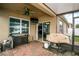 Covered patio with pavers, outdoor kitchen, and grill at 3450 Landing Vw, Tavares, FL 32778