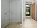 Light and airy entryway with tile floors and neutral colors at 3450 Landing Vw, Tavares, FL 32778