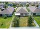 House with backyard, fenced yard, and large trees at 3450 Landing Vw, Tavares, FL 32778