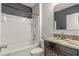 Bathroom with tub shower combo and granite vanity at 3450 Landing Vw, Tavares, FL 32778