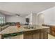 Modern kitchen with granite countertops and stainless steel appliances at 3450 Landing Vw, Tavares, FL 32778