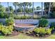 Community entrance sign with landscaping and pool at 3450 Landing Vw, Tavares, FL 32778
