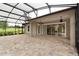 Covered lanai with paver tile floor, ideal for outdoor relaxation at 3457 Lake Diane Rd, Tavares, FL 32778