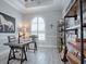 Home office with wood desk, built-in shelving, and a large window at 3457 Lake Diane Rd, Tavares, FL 32778