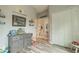 bedroom with gray dresser and door to dining area at 23555 Milford Dr, Eustis, FL 32736