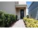 Attractive walkway leads to the home's front entrance, framed by lush landscaping at 17508 Saw Palmetto Ave, Clermont, FL 34714