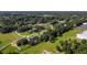 Aerial view of neighborhood, showing houses and surrounding landscape at 24126 Plymouth Hollow Cir, Sorrento, FL 32776