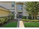 Front entry with a brick walkway and welcoming landscaping at 24126 Plymouth Hollow Cir, Sorrento, FL 32776