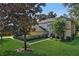 Two-story house with a large front yard and landscaping at 24126 Plymouth Hollow Cir, Sorrento, FL 32776