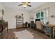Bright home office features built-in desks, large windows, and ample storage at 24126 Plymouth Hollow Cir, Sorrento, FL 32776