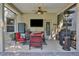 Covered patio with comfortable seating and pool views at 24126 Plymouth Hollow Cir, Sorrento, FL 32776