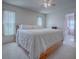 Bright bedroom with a king-size bed and en-suite bathroom access at 220 Willow Brook Dr, Leesburg, FL 34748